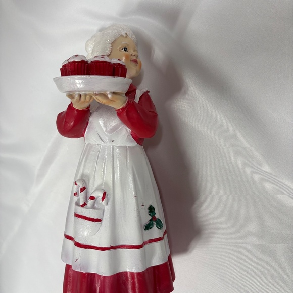 Mrs Claus figurine holding a tray of red cupcakes. - Picture 6 of 7
